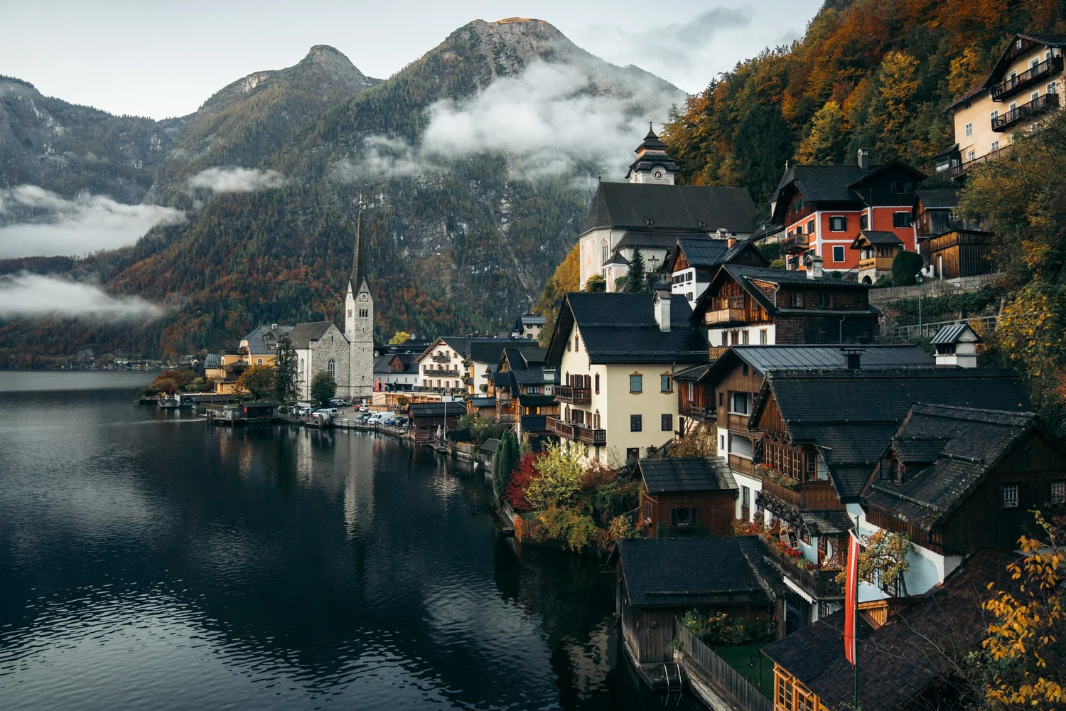 Hallstatt village reflected in its alpine lake, Austria